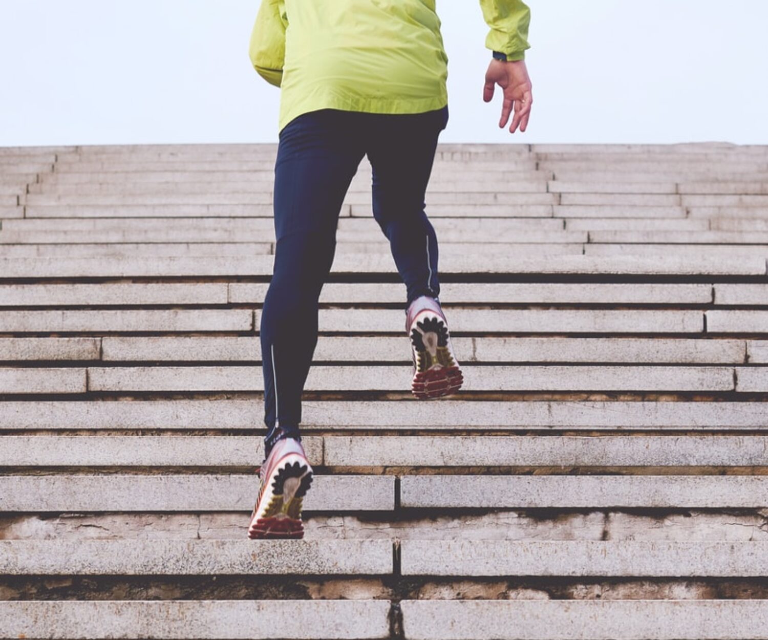 person climbing concrete stairs