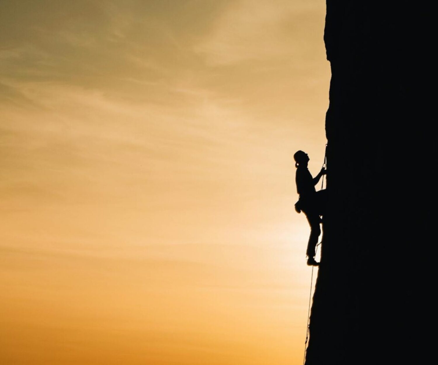 Person Rock Climbing