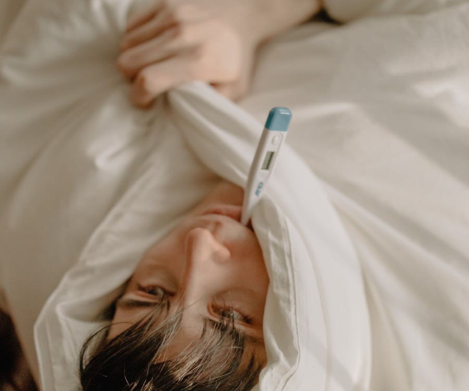 Man in White Shirt Lying on Bed