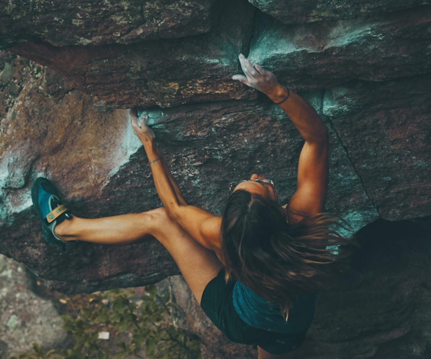 photo of woman climbing mountain