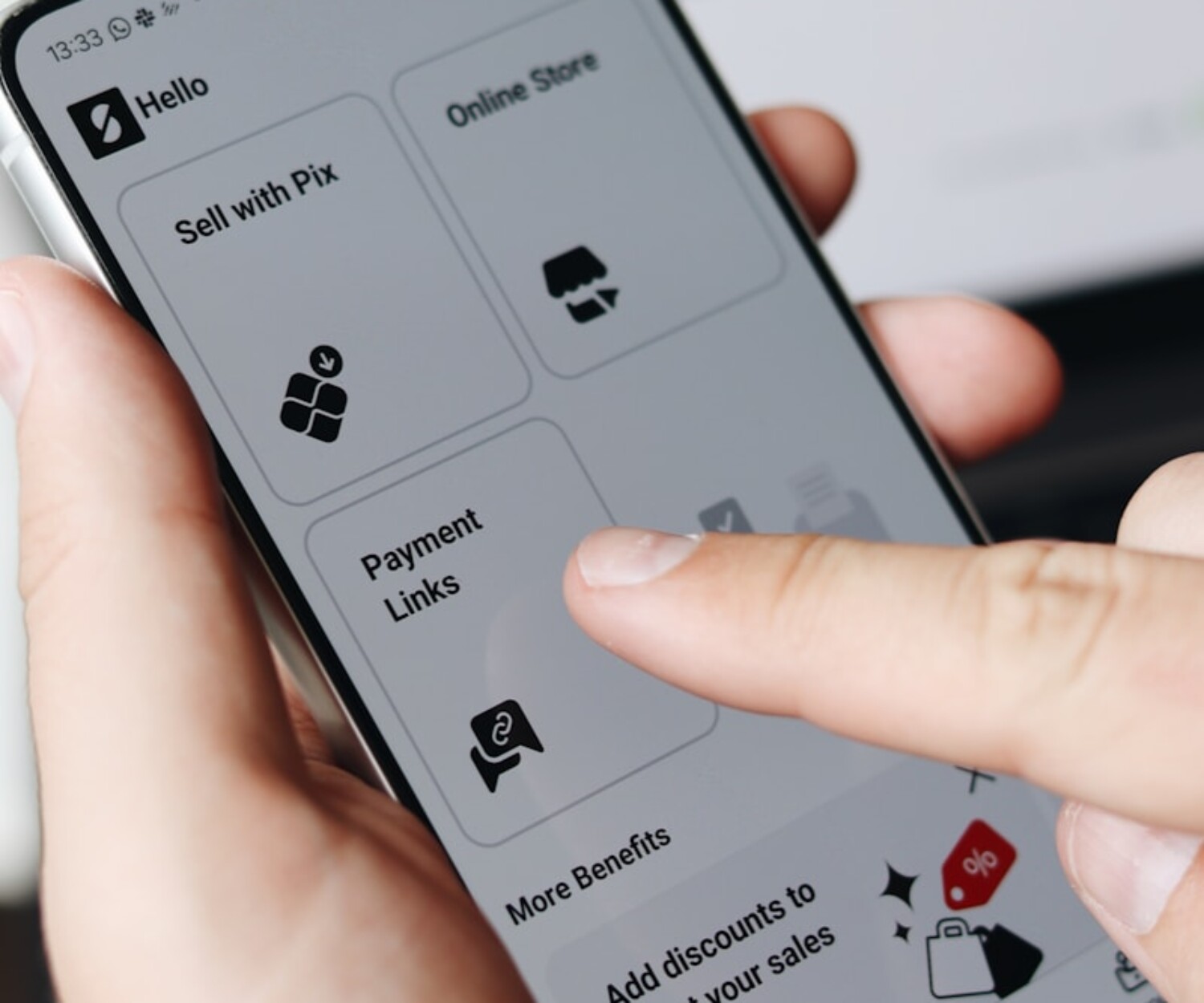 A person holding a cell phone in their hand